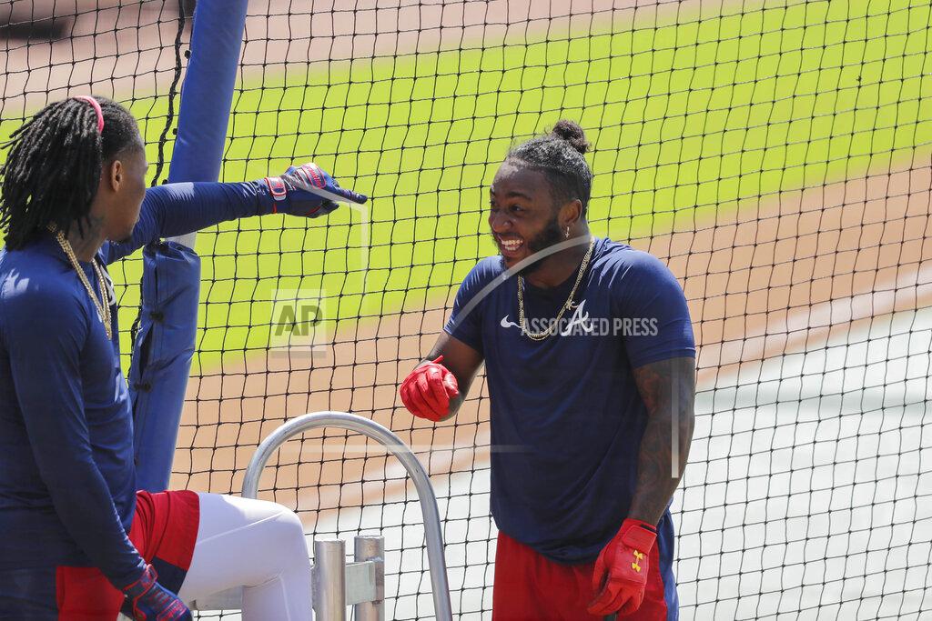 Brynn Anderson Atlanta Braves' Ozzie Albies, right, laughs with Ronald Acuña Jr. before batting during team baseball practice at Truist Park, Sunday, July 5, 2020, in Atlanta. (AP Photo/Brynn Anderson)