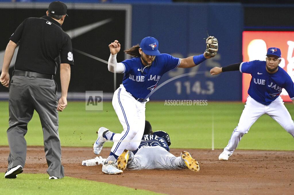 Jon Blacker Tampa Bay Rays' Randy Arozarena slides safely into second with a stolen base ahead of the throw to Toronto Blue Jays' Bo Bichette, middle, during the second inning of a baseball game Tuesday, Sept. 14, 2021, in Toronto. (Jon Blacker/The Canadian Press via AP)