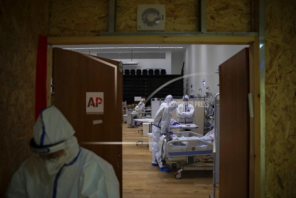 Oded Balilty Medical personnel wearing protective equipment treat COVID-19 patients in an intensive care ward for coronavirus patients at Ziv Medical Center in the northern Israeli city of Safed, Sunday, Feb. 7, 2021. (AP Photo/Oded Balilty)