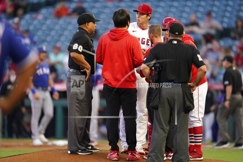 Ashley Landis Los Angeles Angels starting pitcher Shohei Ohtani (17) is checked out on the mound after being hit by a sharp ground ball hit by Texas Rangers' Nathaniel Lowe during the first inning of a baseball game Friday, Sep. 3, 2021, in Anaheim, Calif. (AP Photo/Ashley Landis)
