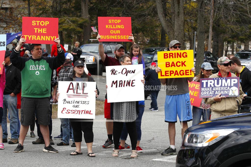 Robert F. Bukaty Protesters rally against the executive orders by Maine Gov. Janet Mills keep some of Maine businesses closed to help prevent the spread of coronavirus, Saturday, May 16, 2020, in Augusta, Maine. (AP Photo/Robert F. Bukaty)