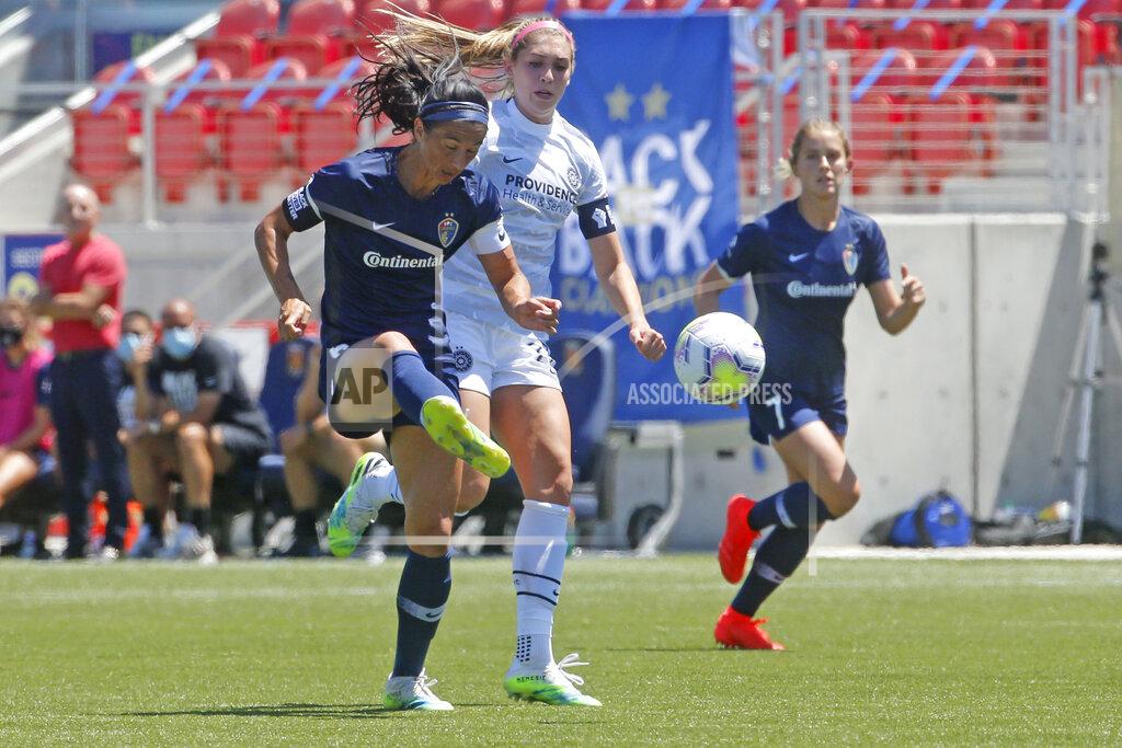 Rick Bowmer North Carolina Courage defender Abby Erceg, left, kicks the ball as Portland Thorns forward Morgan Weaver, center, looks on during the second half of an NWSL Challenge Cup soccer match at Zions Bank Stadium Saturday, June 27, 2020, in Herriman, Utah. Coach Paul Riley calls Erceg the bedrock of the North Carolina Courage. The New Zealand native is captain of the Courage, the two-time National Women's Soccer League defending champions.(AP Photo/Rick Bowmer)