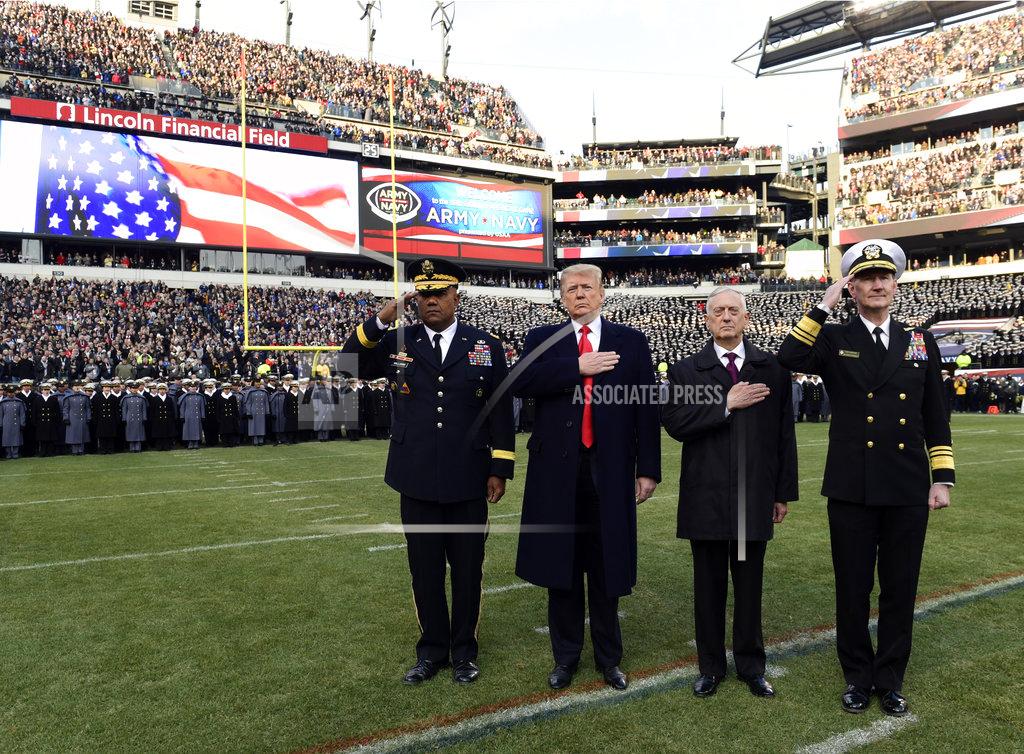 Susan Walsh President Donald Trump, second from left, is joined by, from left, West Point Superintendent Lt. Gen. Darryl A. Williams, Defense Secretary Jim Mattis and Naval Academy Superintendent Vice Adm. Ted Carter, during the playing of the national anthem before the start of the Army-Navy NCAA college football game in Philadelphia, Saturday, Dec. 8, 2018. (AP Photo/Susan Walsh)