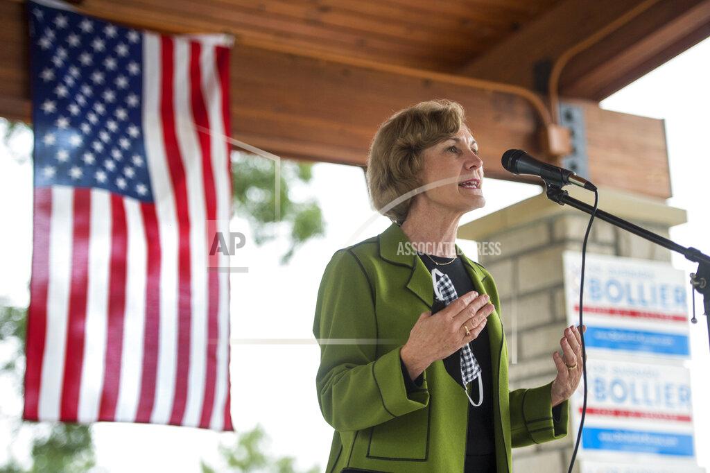 Tammy Ljungblad Democratic candidate Barbara Bollier answers questions during a lawn chair chat with Johnson County voters at Sar-Ko-Par Park, Friday, Sept. 11, 2020, in Lenexa, Kan. Bollier is running for a seat in the U.S. Senate, facing Roger Marshall, a U.S. Representative of Kansas' 1st congressional district. (Tammy Ljungblad/The Kansas City Star via AP)