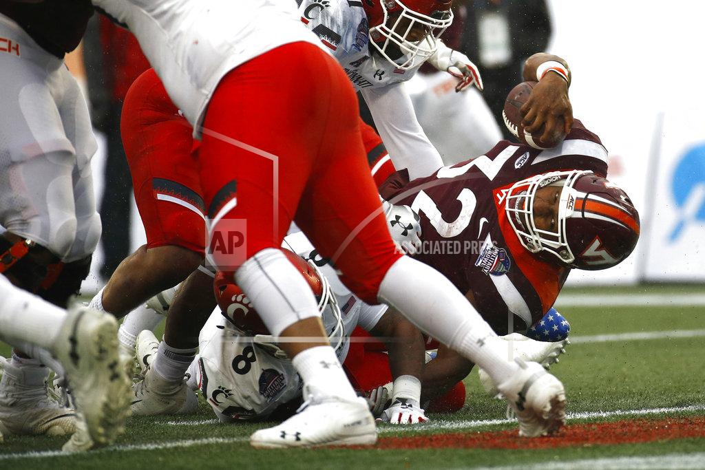 Patrick Semansky Virginia Tech running back Steven Peoples (32) sneaks into the end zone for a touchdown in the first half of the Military Bowl NCAA college football game against Cincinnati, Monday, Dec. 31, 2018, in Annapolis, Md. (AP Photo/Patrick Semansky)