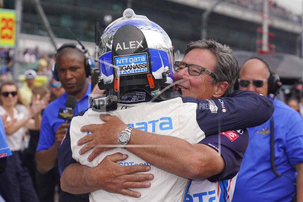 Darron Cummings Alex Palou, of Spain, gets a hug from Barry Wasner, front right, during qualifications for the Indianapolis 500 auto race at Indianapolis Motor Speedway, Sunday, May 22, 2022, in Indianapolis. (AP Photo/Darron Cummings)