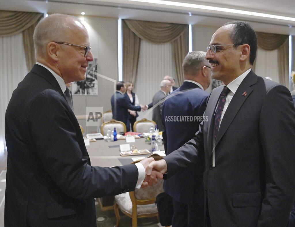 Uncredited Ibrahim Kalin, the spokesman of President Recep Tayyip Erdogan, right, welcomes Swedish State Secretary Oscar Stenstroem, before a meeting with their delegations, in Ankara, Turkey, Wednesday, May 25, 2022. Senior officials from Sweden and Finland met with Turkish counterparts in Ankara on Wednesday in an effort to overcome Turkey's strong objections to the Nordic nations' bids to join NATO. Sweden and Finland submitted their written applications to join NATO last week.(Turkish Presidency via AP)
