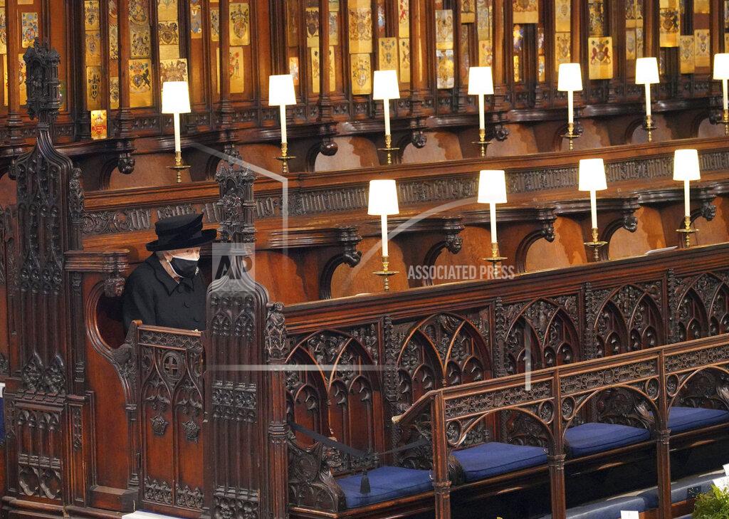 Jonathan Brady Britain's Queen Elizabeth II sits alone in St. George's Chapel during the funeral of Prince Philip, the man who had been by her side for 73 years, at Windsor Castle, Windsor, England, Saturday April 17, 2021. Prince Philip died April 9 at the age of 99 after 73 years of marriage to Britain's Queen Elizabeth II. (Jonathan Brady/Pool via AP)