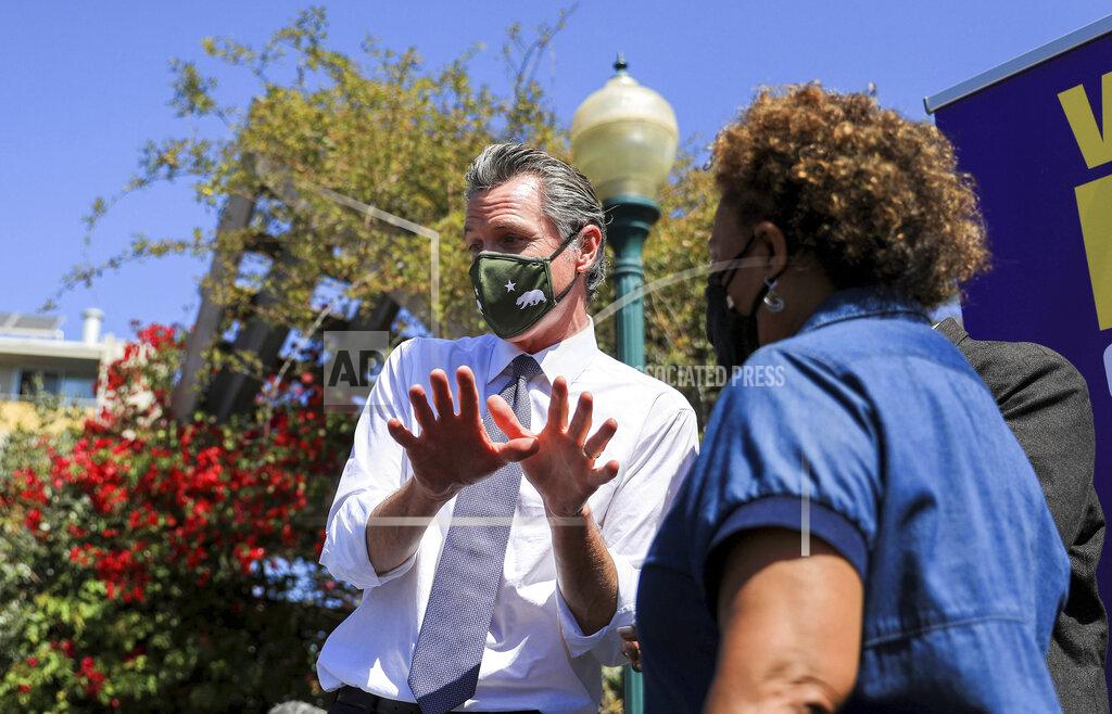 Shae Hammond California Gov. Gavin Newsom is greeted bu supporters at a rally at St. Mary's Center in Oakland, Calif., Saturday, Sept. 11, 2021. The last day to vote in the recall election is Tuesday, Sept. 14. A majority of voters must mark "no" on the recall to keep Newsom in office. (Shae Hammond/Bay Area News Group via AP)