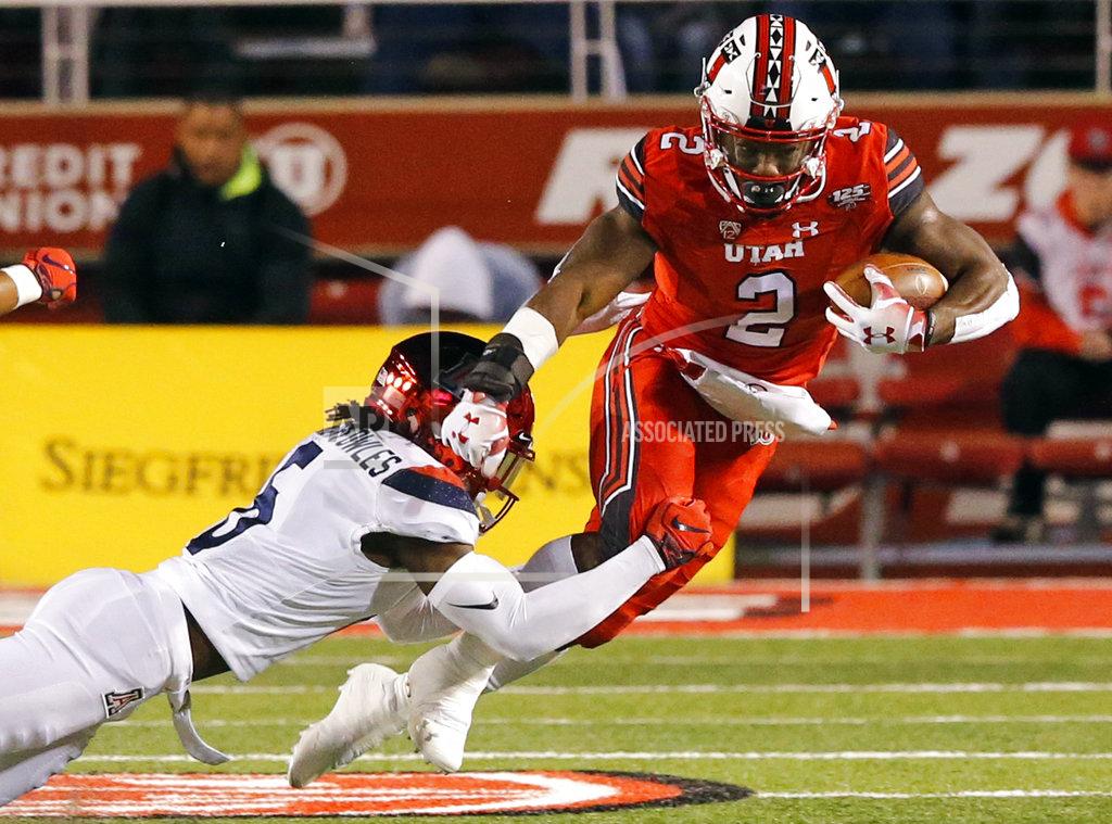 Rick Bowmer Arizona safety Demetrius Flannigan-Fowles (6) tackles Utah running back Zack Moss (2) during the first half during an NCAA college football game Friday, Oct. 12, 2018, in Salt Lake City. (AP Photo/Rick Bowmer)