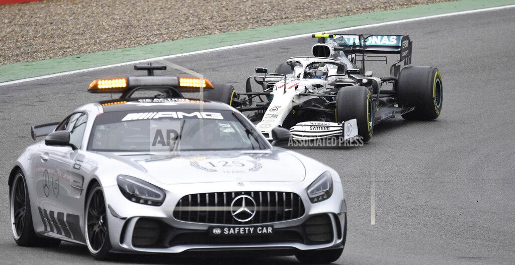 Jens Meyer Mercedes driver Valtteri Bottas of Finland steers his car following the safety car during the German Formula One Grand Prix at the Hockenheimring racetrack in Hockenheim, Germany, Sunday, July 28, 2019. (AP Photo/Jens Meyer)