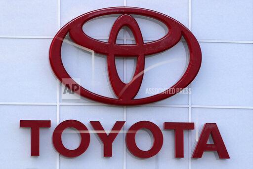 FILE - The Toyota logo is shown on a dealership in Manchester, N.H., in this Thursday, Aug. 15, 2019, file photo. Toyota plans to build a new $1.29 billion factory in the U.S. to manufacture batteries for gas-electric hybrid and fully electric vehicles. The plant location wasn't announced, but the company said it eventually will employ 1,750 people and start making batteries in 2025, gradually expanding through 2031. (AP Photo/Charles Krupa, File)