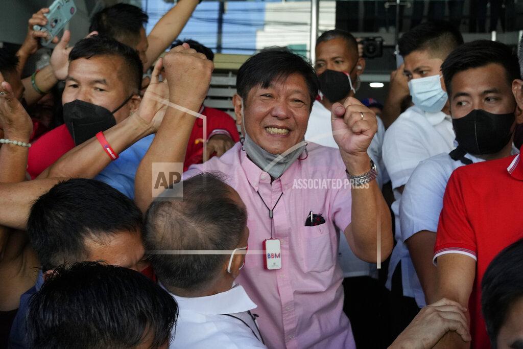 Aaron Favila Presidential candidate Ferdinand "Bongbong" Marcos Jr. celebrates as he greets the crowd outside his headquarters in Mandaluyong, Philippines on Wednesday, May 11, 2022. Marcos' apparent landslide victory in the Philippine presidential election is raising immediate concerns about a further erosion of democracy in Asia and could complicate American efforts to blunt growing Chinese influence and power in the Pacific. (AP Photo/Aaron Favila)