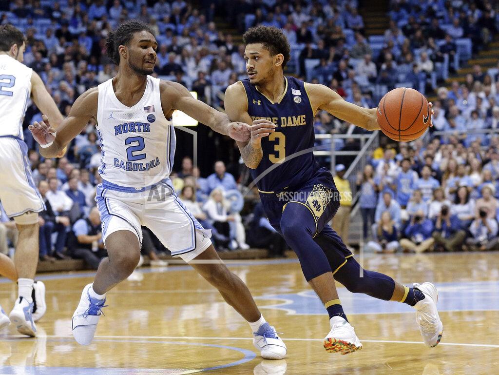 Gerry Broome North Carolina's Coby White (2) guards Notre Dame's Prentiss Hubb (3) during the second half of an NCAA college basketball game in Chapel Hill, N.C., Tuesday, Jan. 15, 2019. North Carolina won 75-69. (AP Photo/Gerry Broome)