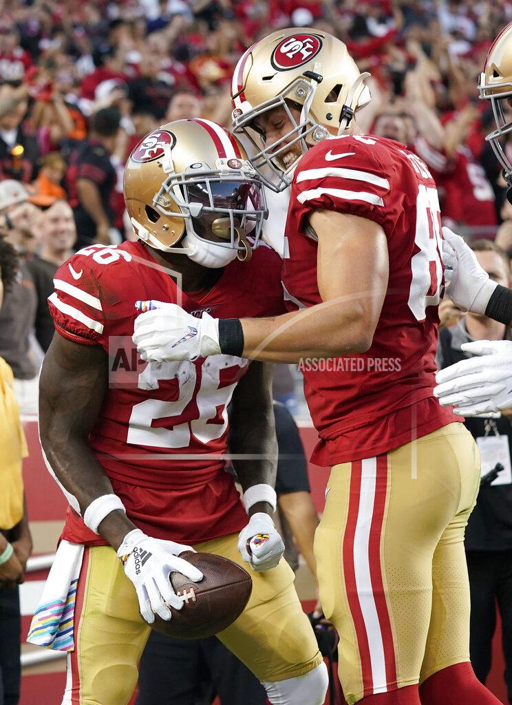Tony Avelar San Francisco 49ers running back Tevin Coleman (26) celebrates with tight end George Kittle after scoring against the Cleveland Browns during the first half of an NFL football game in Santa Clara, Calif., Monday, Oct. 7, 2019. (AP Photo/Tony Avelar)