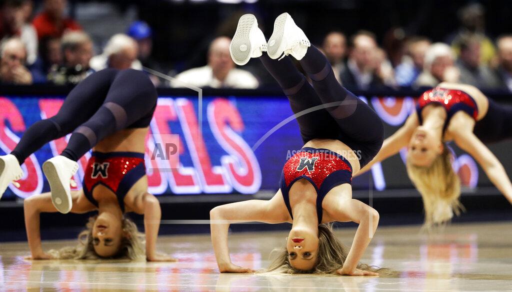 Mark Humphrey The Mississippi dance team performs in the first half of an NCAA college basketball game between Mississippi and Alabama at the Southeastern Conference tournament Thursday, March 14, 2019, in Nashville, Tenn. (AP Photo/Mark Humphrey)