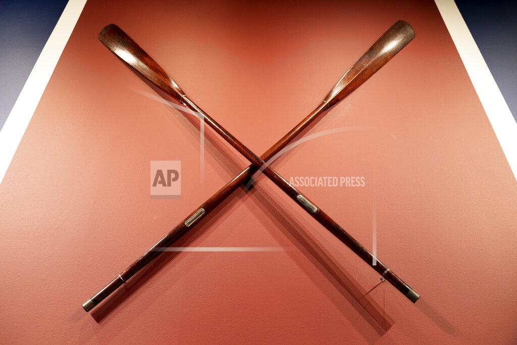 John Minchillo The Harvard-Yale Regatta 1852 Trophy Oars are displayed before an auction, Thursday, April 21, 2022, at Sotheby's in the Manhattan borough of New York. Sotheby's estimates the oars value between three and five million dollars. The oars were awarded to Harvard's winning crew and represent one of the oldest collegiate athletic competitions in the nation's history. (AP Photo/John Minchillo)
