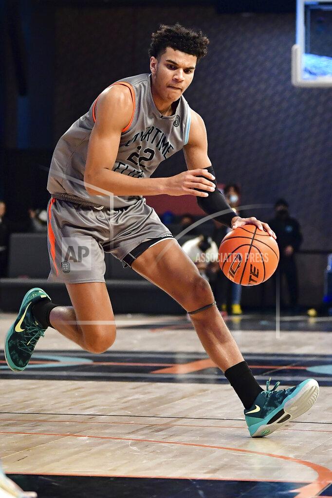Kyle Hess In this photo provided by Overtime Elite, Dominick Barlow plays basketball at OTE Arena in Atlanta, Saturday, Feb. 26, 2022. Barlow will be one of the 76 prospects at the NBA draft combine this week in Chicago. But he didn’t take the conventional route through the college ranks. Or the NBA’s G League Ignite. Or playing overseas. He turned down college offers to receive on-the-job training through Overtime Elite, a new basketball league created to give high school players another path to the pros. He got paid -- a six-figure salary -- as he learned about nutrition, social-media skills, financial literacy and, of course, the art of basketball. (Kyle Hess/Overtime Elite via AP)