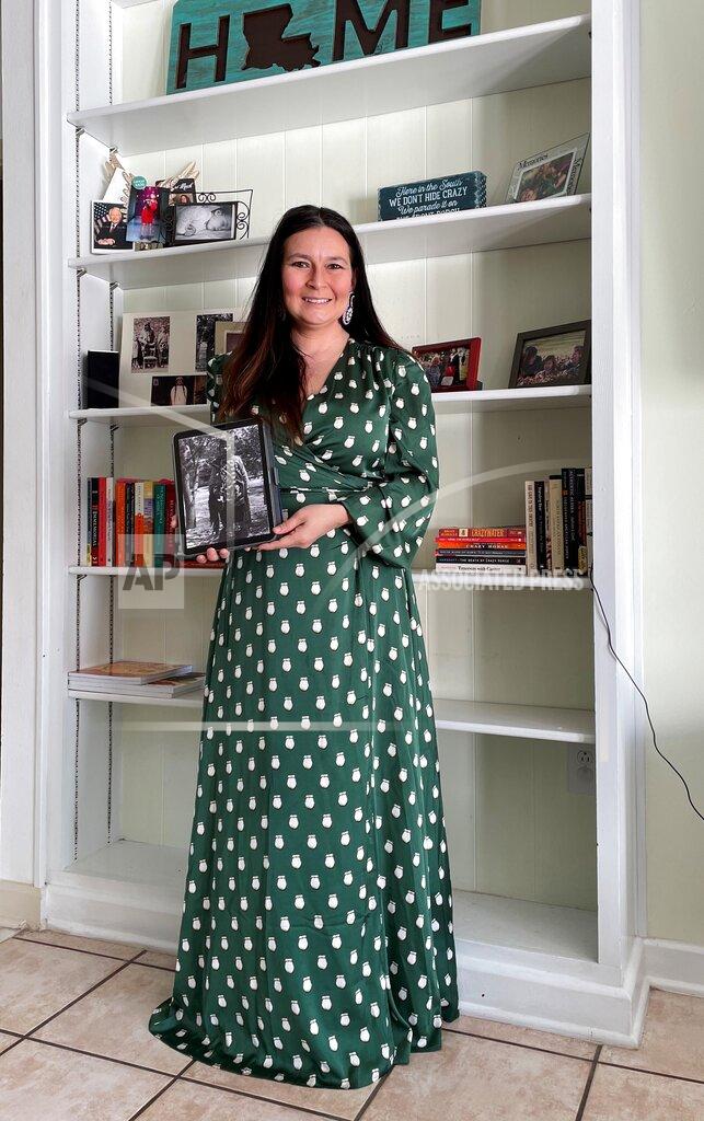 Brandi Liberty This photo provided by Brandi Liberty shows Liberty holding a photo of her grandmother as a child at Liberty's home in New Orleans on Monday, Feb. 22, 2021. Liberty is among Native Americans who will be closely watching the confirmation hearing for Deb Haaland, a New Mexico congresswoman who has been nominated to lead the U.S. Department of the Interior. (Brandi Liberty via AP)