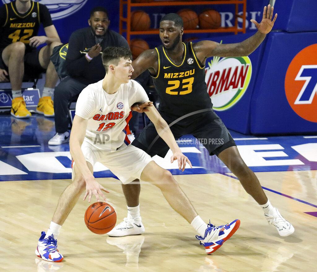 Brad Mcclenny Florida forward Colin Castleton (12) drives the ball during an NCAA college basketball game against Missouri, Wednesday, March 3, 2021 in Gainesville, Fla. (Brad McClenny/The Gainesville Sun via AP)