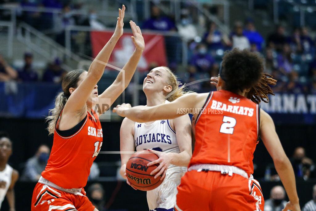 Michael Wyke Stephen F. Austin guard Stephanie Visscher, middle, puts up a shot between Sam Houston State forward Kaylee Jefferson (13) and forward Amber Leggett (2) during the first half of an NCAA college basketball game for the Southland Conference women's tournament championship Sunday, March 14, 2021, in Katy, Texas. (AP Photo/Michael Wyke)