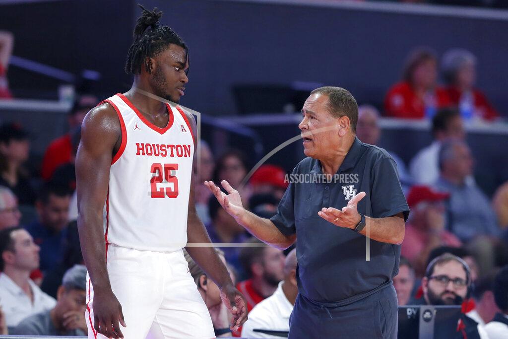 Michael Wyke Houston head coach Kelvin Sampson, right, talks with forward Jarace Walker (25) during the second half of an NCAA college basketball game against Northern Colorado, Monday, Nov. 7, 2022, in Houston. (AP Photo/Michael Wyke)