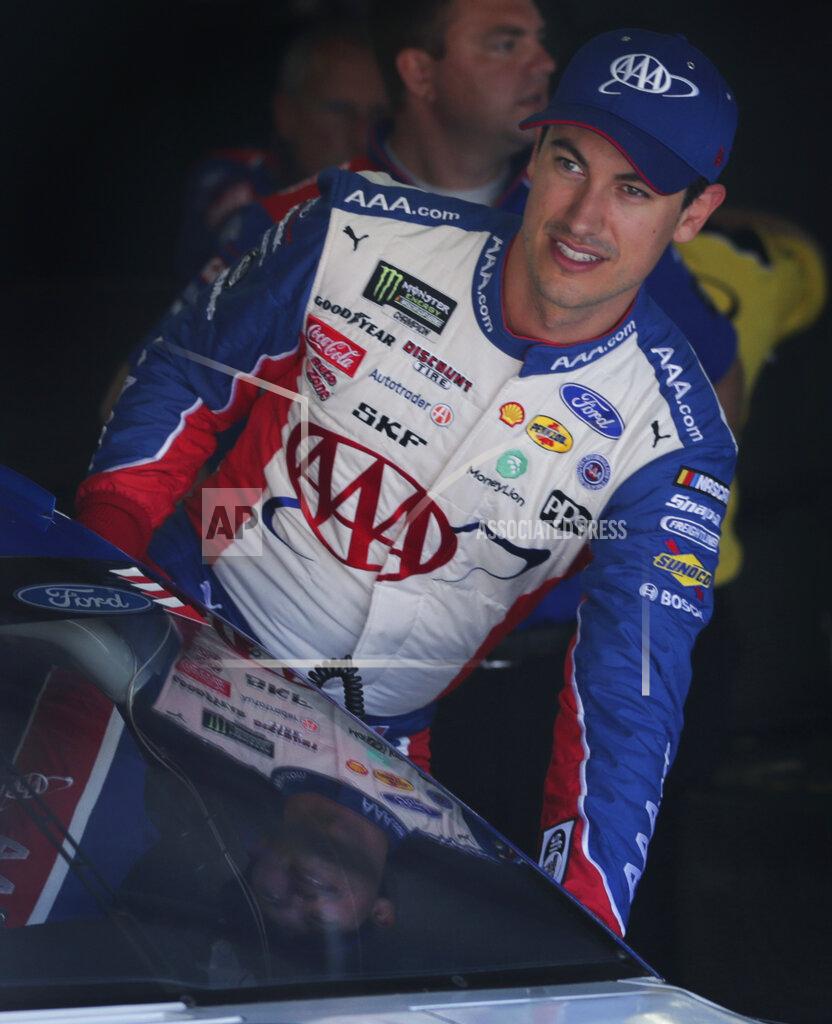 Charles Krupa Joey Logano climbs into his car as he prepares for a NASCAR Cup Series auto race practice at New Hampshire Motor Speedway in Loudon, N.H., Saturday, July 20, 2019. (AP Photo/Charles Krupa)