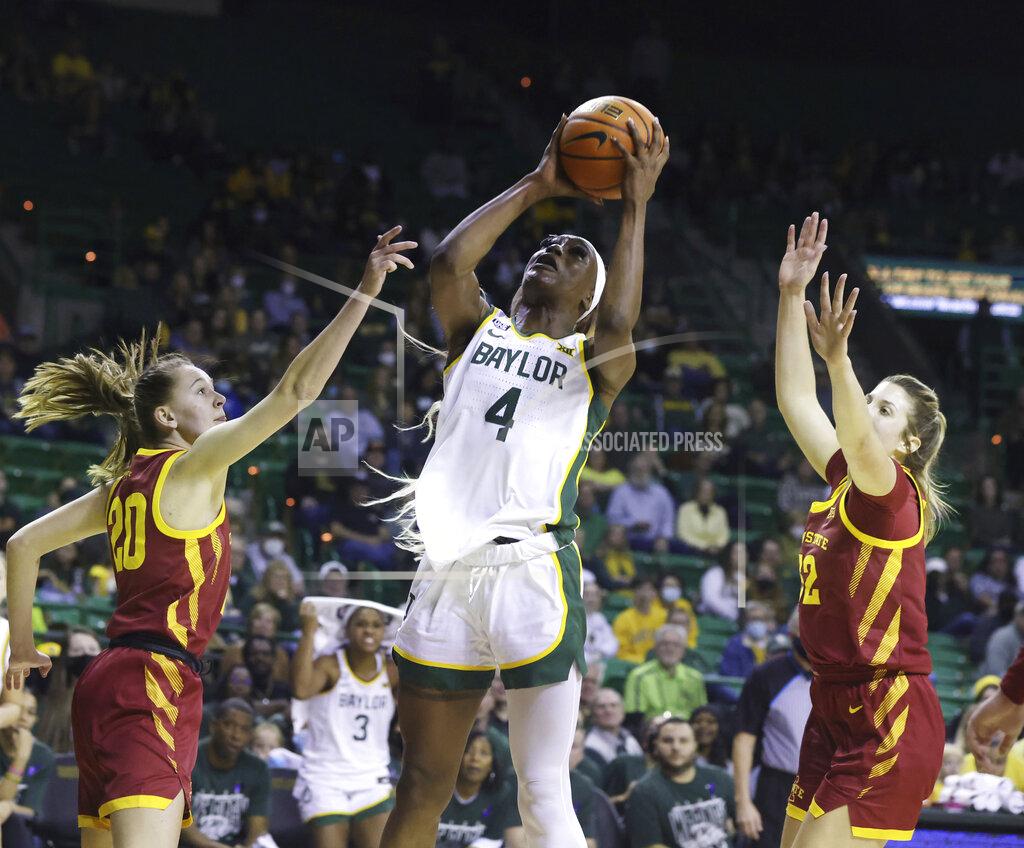 Rod Aydelotte Baylor center Queen Egbo, center, shoots between Iowa State guard Aubrey Joens, left, and teammate Maggie Vick, right, in the second half of an NCAA college basketball game, Sunday, Jan. 23, 2022, in Waco, Texas. (Rod Aydelotte/Waco Tribune-Herald via AP)