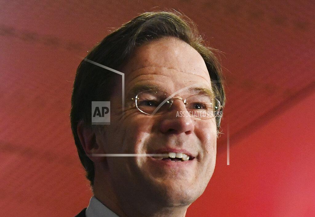 Piroschka Van De Wouw Dutch caretaker Prime Minister Mark Rutte speaks with the media following exit polls in the general election in The Hague, Netherlands, March 17, 2021. Dutch voters pushed Rutte towards a fourth term in office in a general election Wednesday, bolstering his conservative party's position as the biggest in parliament and boosting a key ally into second place, an exit poll suggested. (Piroschka van de Wouw/Pool via AP)
