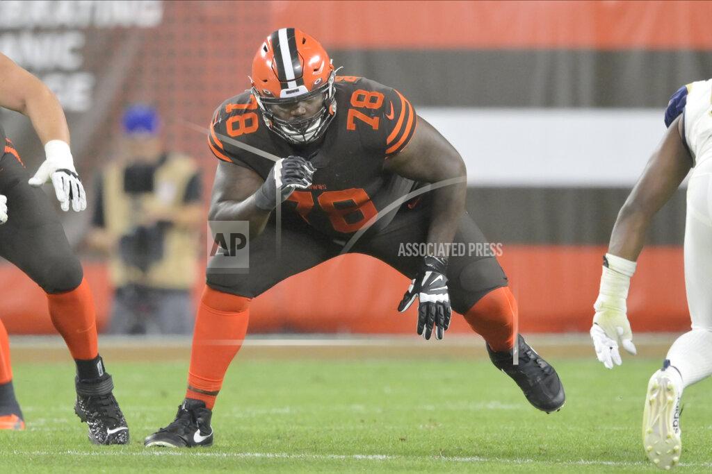 David Richard FILE - In this Sept. 22, 2019, file photo, Cleveland Browns offensive tackle Greg Robinson (78) blocks during an NFL football game against the Los Angeles Rams in Cleveland. Browns starting left offensive tackle Greg Robinson has been benched. It’s likely that he will be replaced by Justin McCray, who has not started an NFL game at left tackle and has played their sparingly during his career. (AP Photo/David Richard, File)
