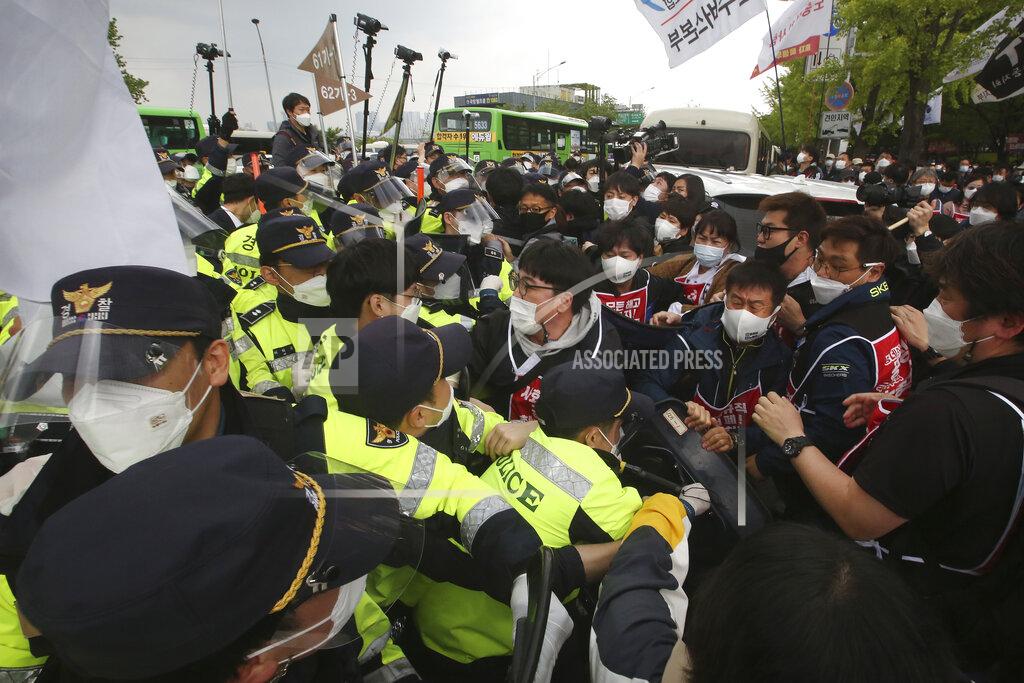 Ahn Young-Joon Members of the Korean Confederation of Trade Unions scuffle with police officers during a May Day rally demanding better working conditions and expanding labor rights in Seoul, South Korea, Saturday, May 1, 2021. (AP Photo/Ahn Young-joon)