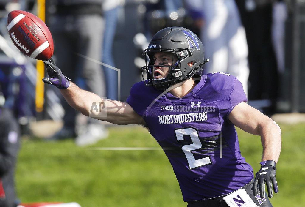 Jim Young Northwestern's Flynn Nagel celebrates his touchdown against Nebraska during the second half of an NCAA college football game Saturday, Oct. 13, 2018, in Evanston, Ill.. (AP Photo/Jim Young)