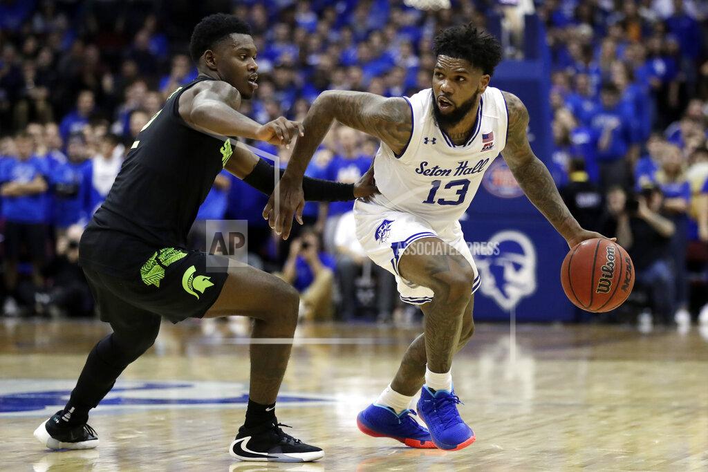Adam Hunger Seton Hall guard Myles Powell (13) drives to the basket past Michigan State guard Rocket Watts during the second half of an NCAA college basketball game Thursday, Nov. 14, 2019, in Newark, N.J. (AP Photo/Adam Hunger)