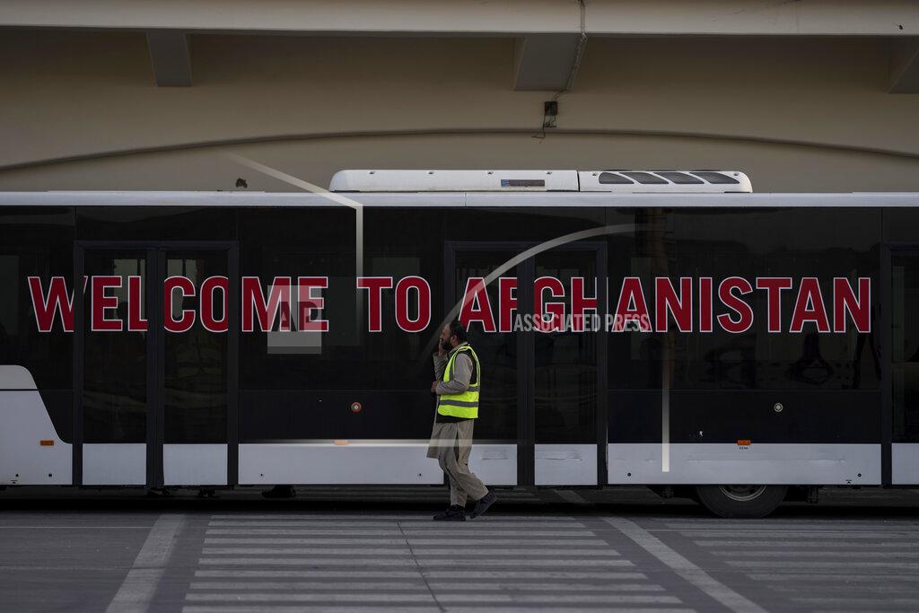 Bernat Armangue An airport staffer walks past a bus at the airport in Kabul, Afghanistan, Thursday, Sept. 9, 2021. Some 200 foreigners, including Americans, flew out of Afghanistan on an international commercial flight from Kabul airport on Thursday, the first such large-scale departure since U.S and foreign forces concluded their frantic withdrawal at the end of last month. (AP Photo/Bernat Armangue)