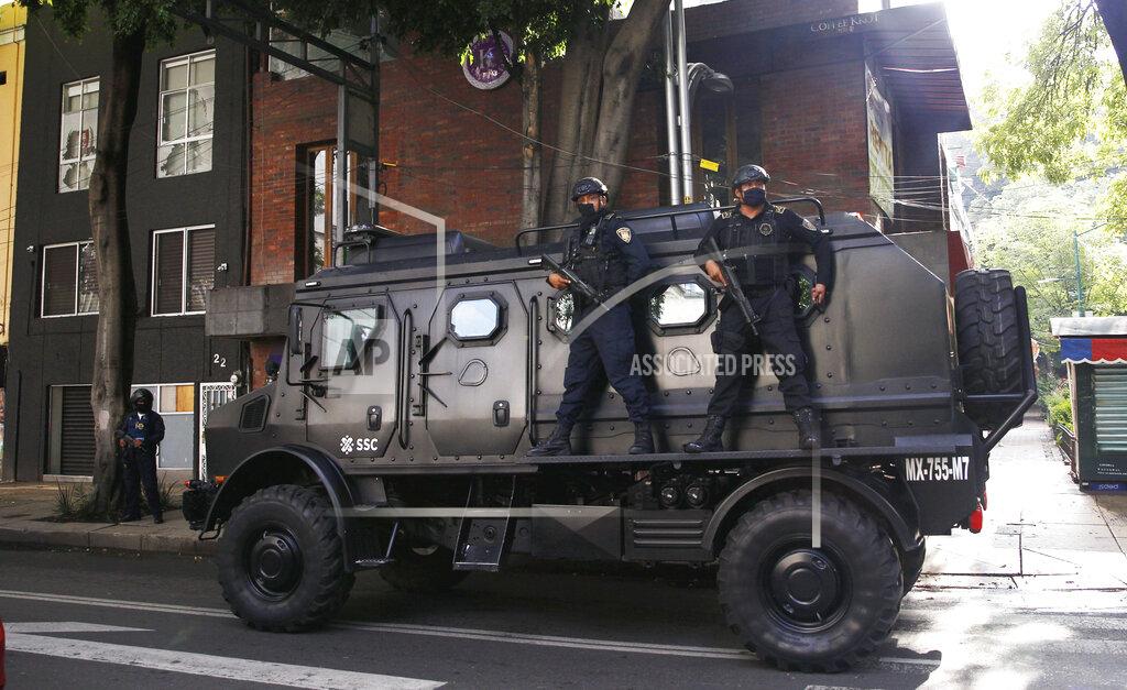 Marco Ugarte A police vehicle arrives to the place where an abandoned vehicle that is believed to have been used by gunmen in an attack against the chief of police was found, in Mexico City, Friday, June 26, 2020. Heavily armed gunmen attacked and wounded Omar Garcia Harfuch in a brazen operation that left an unspecified number of dead, Mayor Claudia Sheinbaum said Friday. (AP Photo/Marco Ugarte)