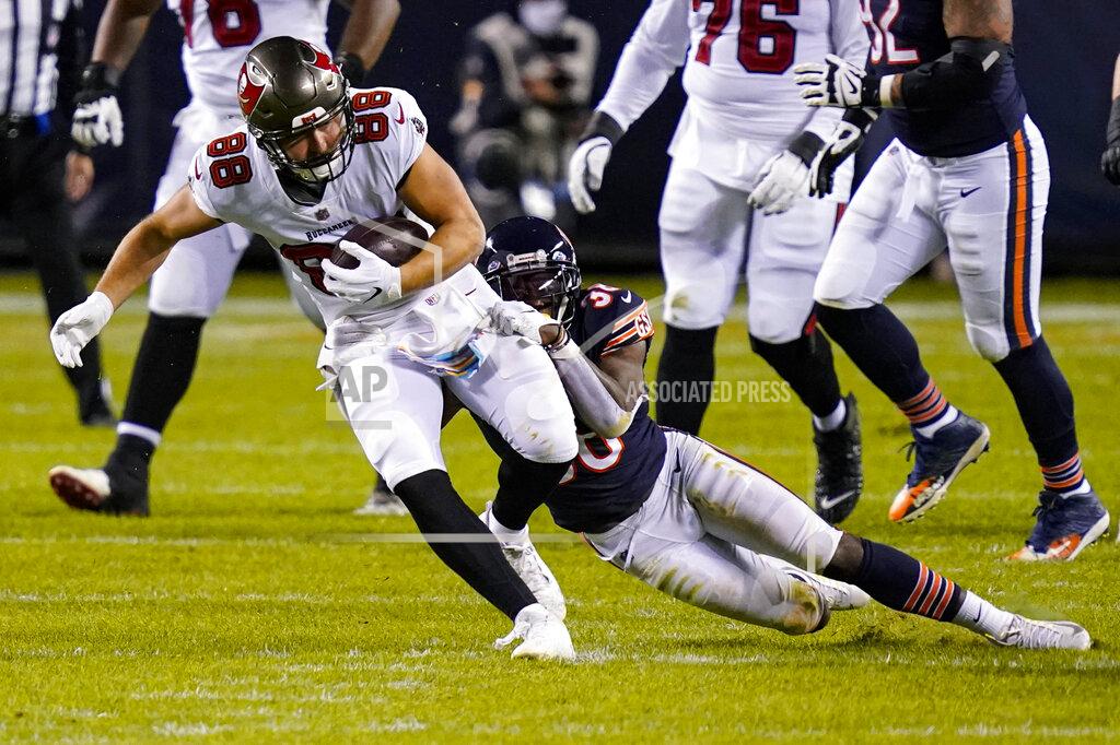 Charles Rex Arbogast Tampa Bay Buccaneers tight end Tanner Hudson (88) is tackled by Chicago Bears safety Tashaun Gipson (38) after a catch during the first half of an NFL football game in Chicago, Thursday, Oct. 8, 2020. (AP Photo/Charles Rex Arbogast)