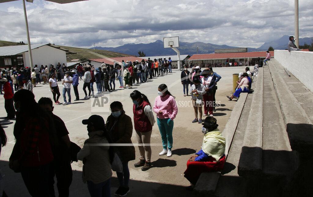Dolores Ochoa People line up to cast their ballots in Cangahua, Ecuador, Sunday, Feb. 7, 2021. Ecuadoreans went to the polls in first-round presidential legislative elections. (AP Photo/Dolores Ochoa)