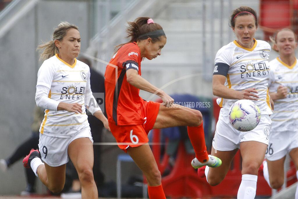 Rick Bowmer Houston Dash forward Shea Groom (6) takes a shot as Utah Royals FC midfielder Lo'eau LaBonta (9) defends during the first half of an NWSL Challenge Cup soccer match at Zions Bank Stadium Tuesday, June 30, 2020, in Herriman, Utah. (AP Photo/Rick Bowmer)