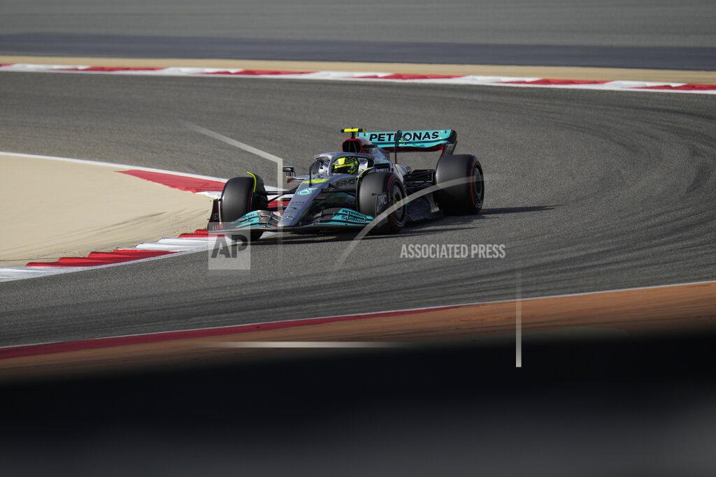 Hassan Ammar Mercedes driver Lewis Hamilton of Britain steers his car during a practice for theFormula One Bahrain Grand Prix it in Sakhir, Bahrain, Saturday, March 19, 2022. (AP Photo/Hassan Ammar)