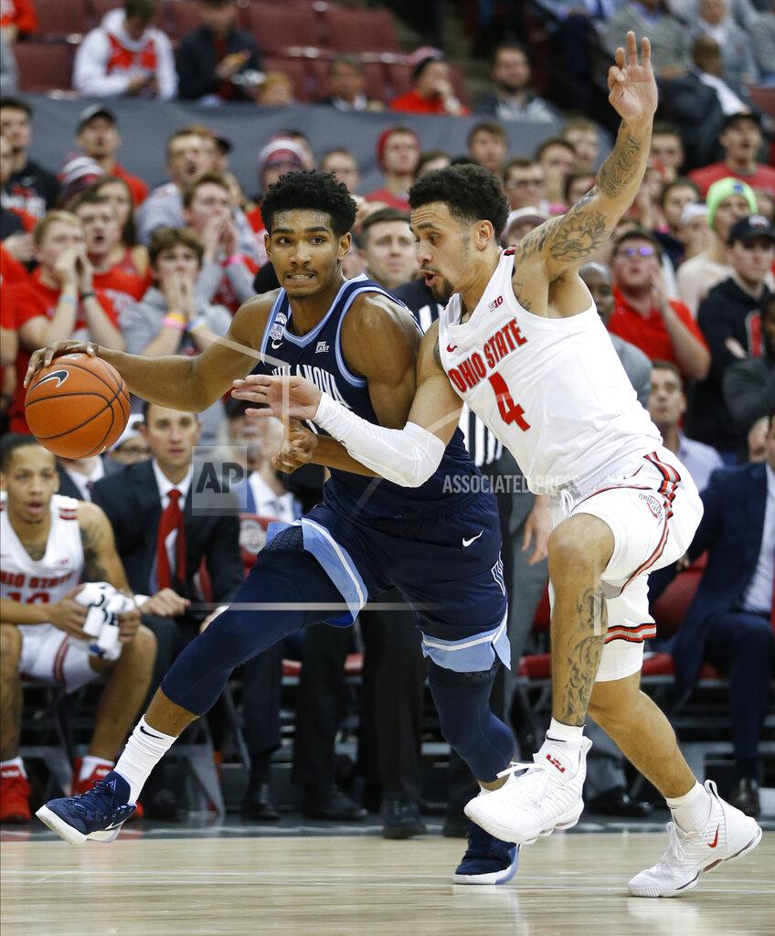 Jay Laprete Villanova's Jermaine Samuels, left, tries to dribble past Ohio State's Duane Washington during the first half of an NCAA college basketball game Wednesday, Nov. 13, 2019, in Columbus, Ohio. (AP Photo/Jay LaPrete)