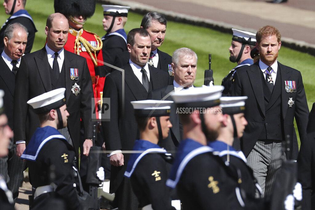 Gareth Fuller The Earl of Snowdon, Britain's Prince William, Peter Phillips, Vice Admiral Sir Timothy Laurence, Prince Andrew and Prince Harry, from left, follow the coffin as it slowly makes its way in a ceremonial procession during the funeral of Britain's Prince Philip inside Windsor Castle in Windsor, England, Saturday, April 17, 2021. (Gareth Fuller/Pool via AP)
