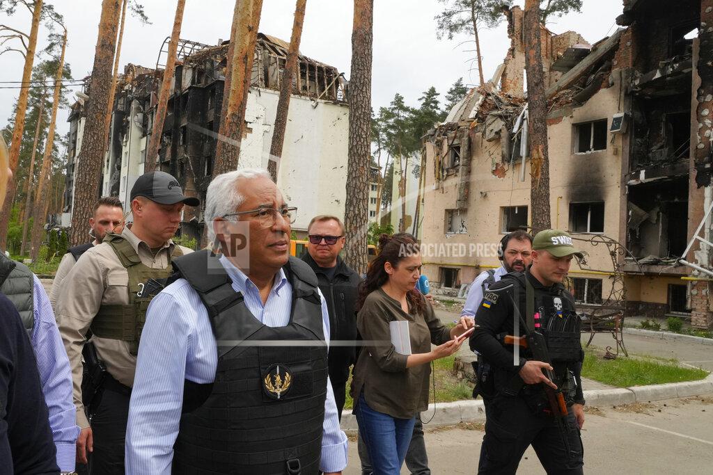 Efrem Lukatsky Portuguese Prime Minister Antonio Costa, center left, walks surrounded by media and security in Irpin, Ukraine, Saturday, May 21, 2022. (AP Photo/Efrem Lukatsky)