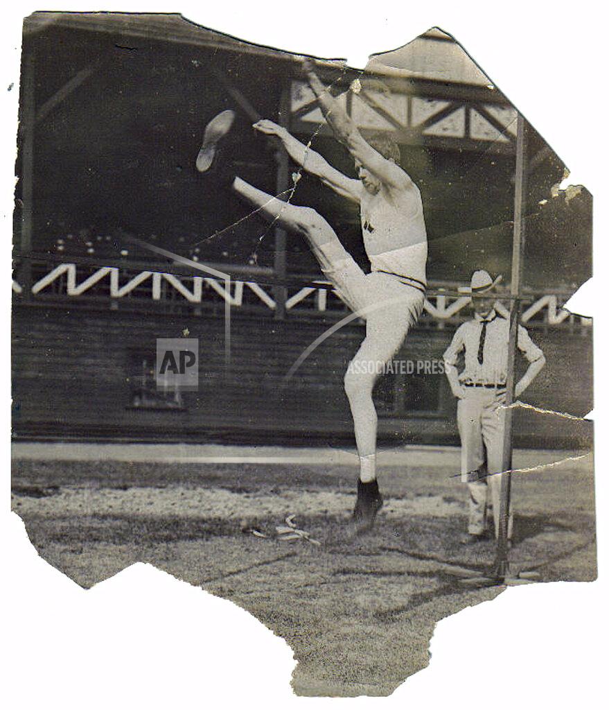 Uncredited This undated image provided courtesy of Thomas Carson, shows Ray Ewry competing in the standing high jump. Ewry began one of the greatest Olympic careers in history at the 1900 Paris Games. The American jumper excelled in the standing high jump, standing long jump and standing triple jump around the turn of the century and won all three events in Paris on the same day. (Courtesy Thomas Carson via AP)