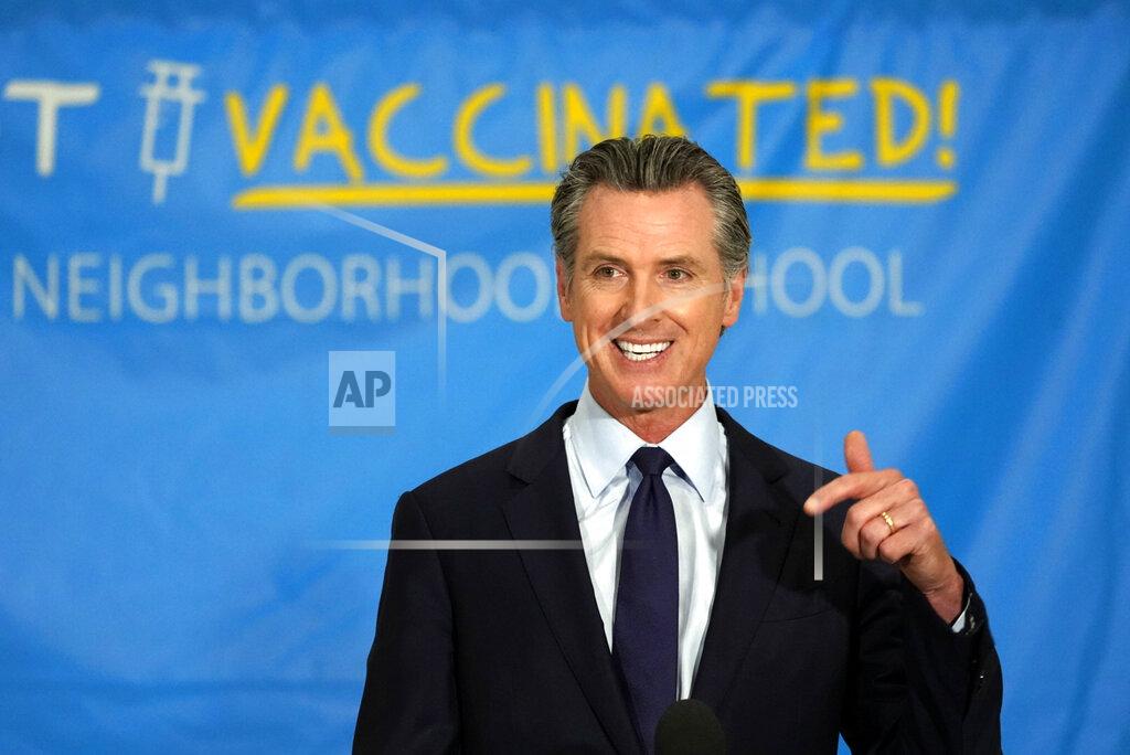California Gov. Gavin Newsom announces a massive jackpot as the nation's most populous state looks to encourage millions of people who are still unvaccinated to get their shots at a news conference at the Esteban E. Torres High School in Los Angeles, Thursday, May 27, 2021. California is giving away the country's largest pot of vaccine prize money — $116.5 million — in an attempt to get millions more inoculated before the most populous U.S. state fully reopens next month. Newsom announced the prizes, which also include the nation's highest single vaccine prize: $1.5 million. (AP Photo/Damian Dovarganes)