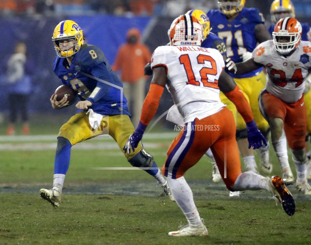 Chuck Burton Pittsburgh's Kenny Pickett (8) scrambles as Clemson's K'Von Wallace (12) defends in the second half of the Atlantic Coast Conference championship NCAA college football game in Charlotte, N.C., Saturday, Dec. 1, 2018. (AP Photo/Chuck Burton)