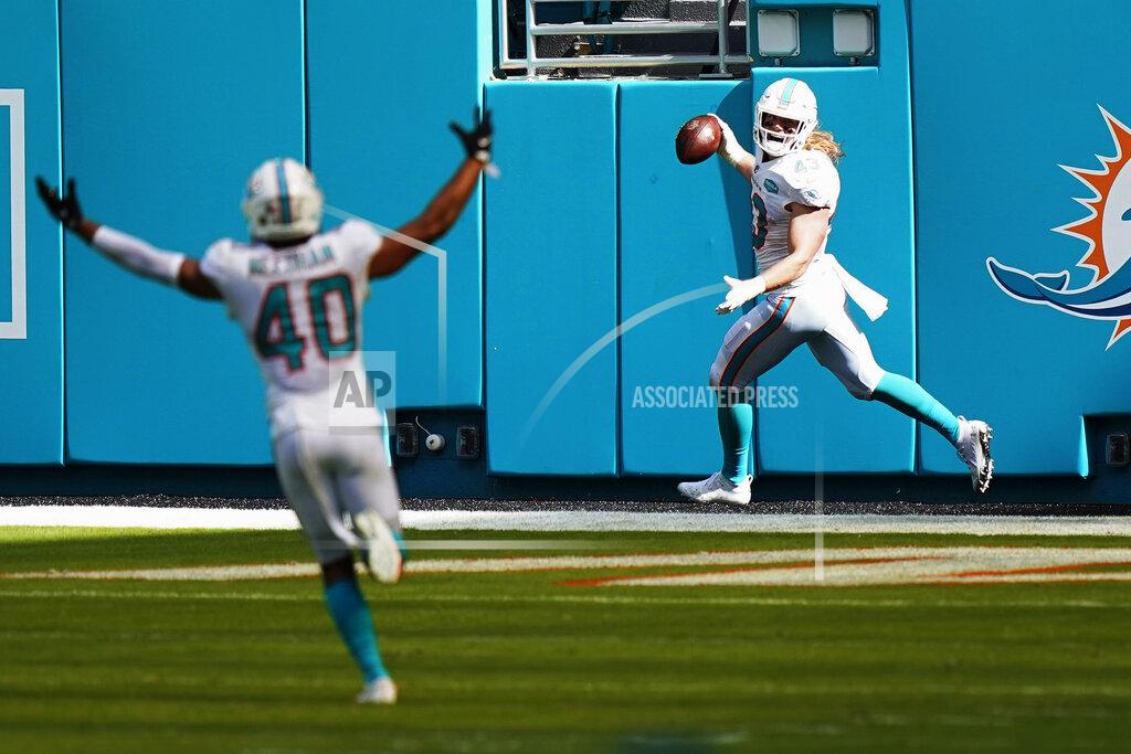 Wilfredo Lee FILE - In this Nov. 1, 2020, filer photo, Miami Dolphins outside linebacker Andrew Van Ginkel (43) smiles after scoring a touchdown during the first half of an NFL football game against the Los Angeles Rams in Miami Gardens, Fla. Van Ginkel picked up the ball after Los Angeles Rams quarterback Jared Goff (16) was sacked and fumbled the ball. Twelve months ago, they were 0-7 under first-year coach Brian Flores and allowing 34.0 points a game, and they went on to surrender the most points in franchise history. They've gone from worst to first in the NFL, and are now giving up 18.6 points per game. (AP Photo/Wilfredo Lee, File)
