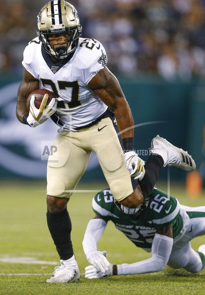 Adam Hunger New Orleans Saints' Dwayne Washington (27) runs past New York Jets' Alex Brown (25) during the first half of a preseason NFL football game Saturday, Aug. 24, 2019, in East Rutherford, N.J. (AP Photo/Adam Hunger)