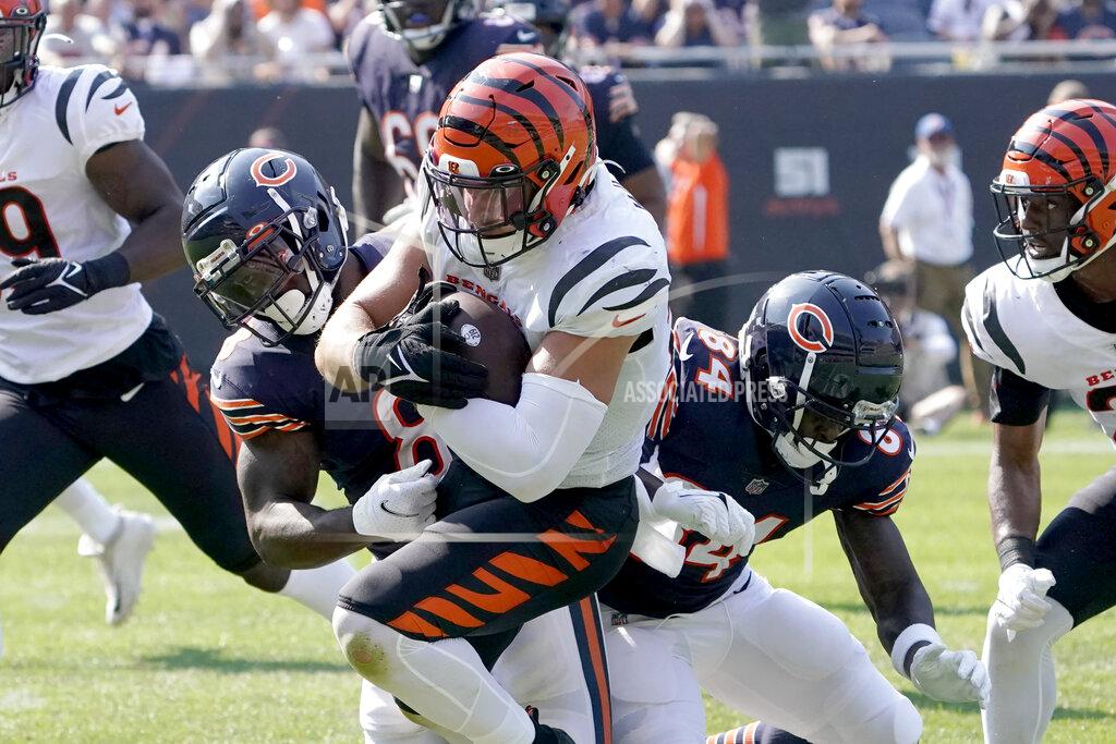 David Banks Cincinnati Bengals linebacker Logan Wilson advances his interception of Chicago Bears quarterback Justin Fields as Chicago Bears running back Damien Williams and Marquise Goodwin make the tackle during the second half of an NFL football game Sunday, Sept. 19, 2021, in Chicago. The Bears won 20-17. (AP Photo/David Banks)