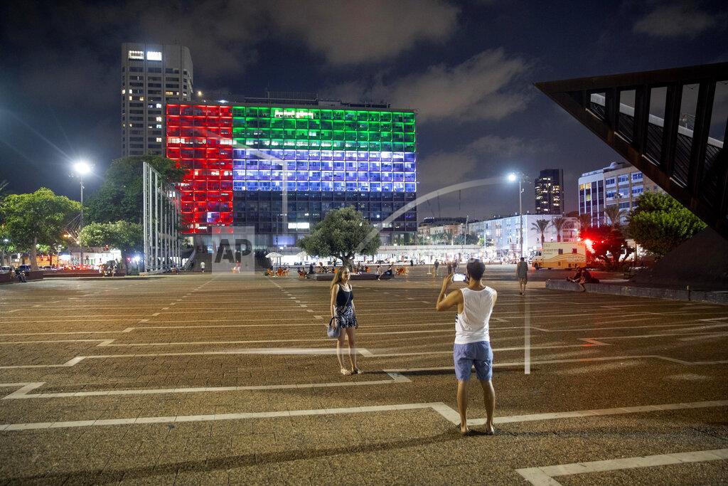 Oded Balilty Tel Aviv City Hall is lit up with the flags of the United Arab Emirates and Israel as the countries announced they would be establishing full diplomatic ties, in Tel Aviv, Israel, Thursday, Aug. 13, 2020. In a nationally broadcast statement, Prime Minister Benjamin Netanyahu said the "full and official peace" with the UAE would lead to cooperation in many spheres between the countries and a "wonderful future" for citizens of both countries. (AP Photo/Oded Balilty)