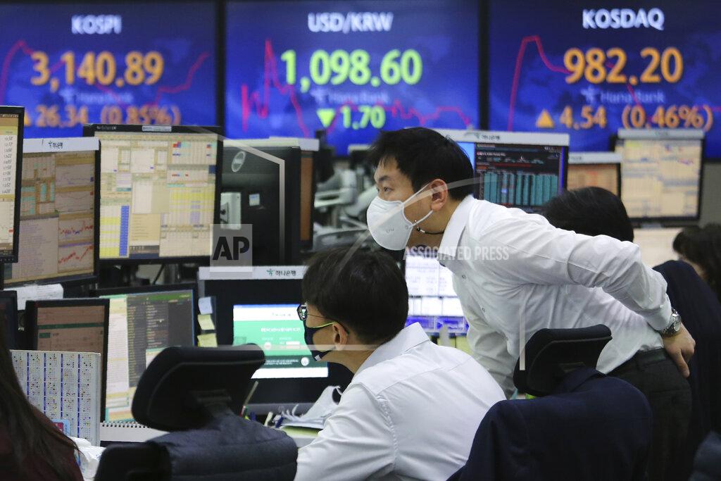 Ahn Young-Joon Currency traders watch monitors at the foreign exchange dealing room of the KEB Hana Bank headquarters in Seoul, South Korea, Thursday, Jan. 21, 2021. Asian shares rose Thursday on optimism over the new U.S. administration that earlier set off a rally on Wall Street. (AP Photo/Ahn Young-joon)